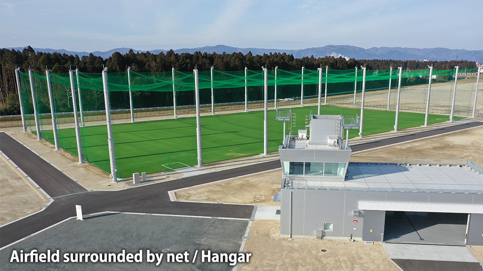 Airfield surrounded by net / Hangar